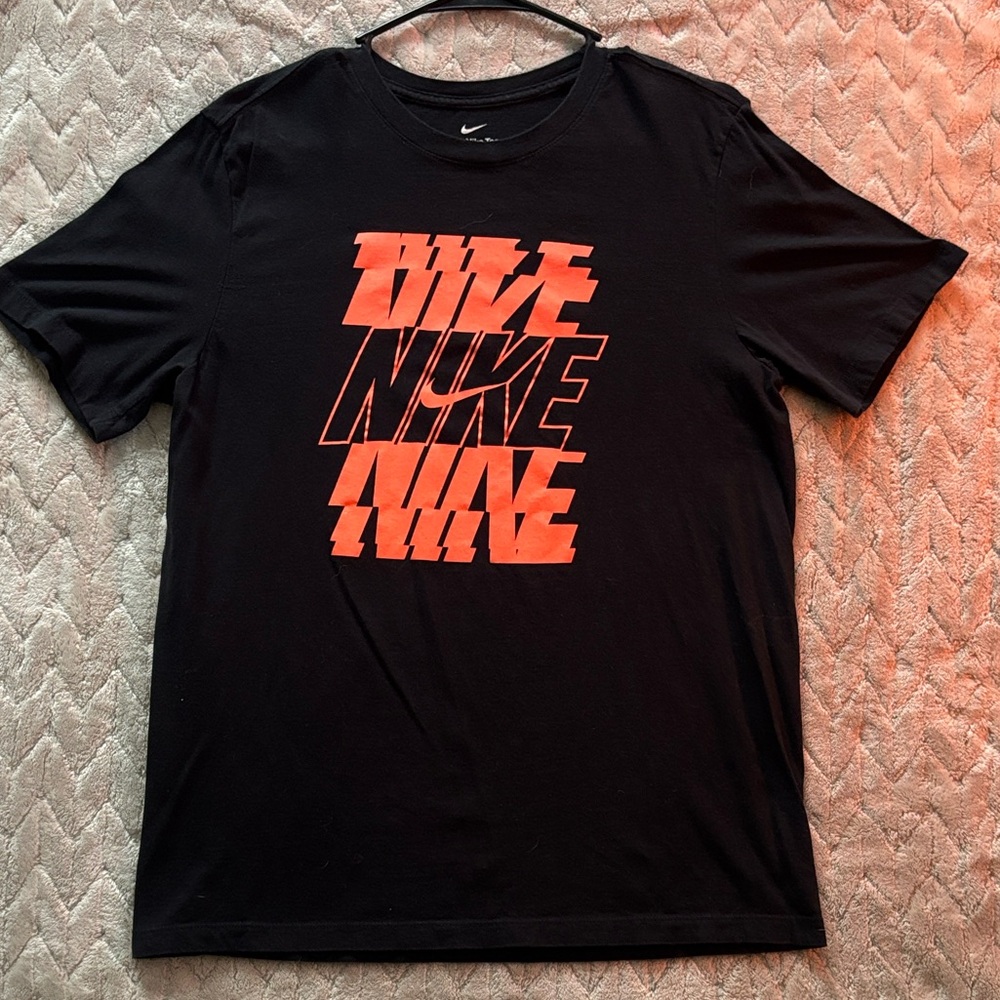 Nike Men's Black Tee with Vibrant Orange Graphic
